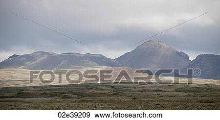 Landscape, distant mountain range, grasslands in forefront View Large Photo Image Stock Photo - Landscape, distant mountain range, grasslands in forefront. Fotosearch