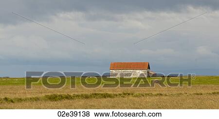 Landscape, farm building on the prairies, circular hay bale View Large Photo Image Stock Photo - Landscape, farm building on the prairies, circular hay bale. Fotosearch