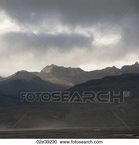 Landscape, mountain range under stormy skies View Large Photo Image Stock Image - Landscape, mountain range under stormy skies. Fotosearch