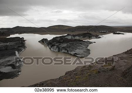 Landscape of dirty melting glaciers in a glacial lake View Large Photo Image Stock Photography - Landscape of dirty melting glaciers in a glacial lake. Fotosearch