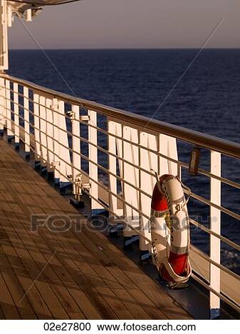 Stock Image - Life preserver on side of cruise ship. Fotosearch