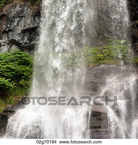 Low angle view of a waterfall, Steinsdalsfossen, Norheimsund, Hardangervidda, Hardanger, Norway View Large Photo Image Picture - Low angle view of a waterfall, Steinsdalsfossen, Norheimsund, Hardangervidda, Hardanger, Norway. Fotosearch