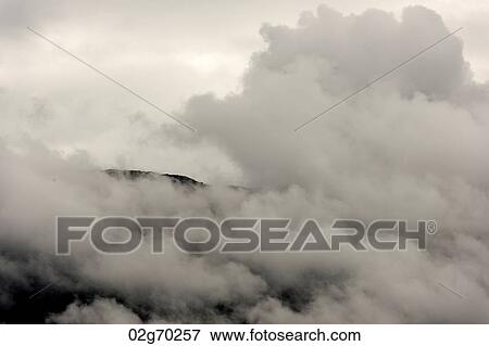Low angle view of fog over mountain, Hardangervidda, Hardanger, Norway View Large Photo Image Stock Photo - Low angle view of fog over mountain, Hardangervidda, Hardanger, Norway. Fotosearch