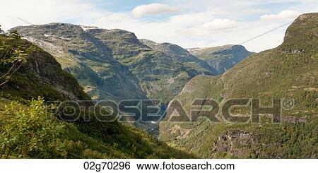 Stock Photograph - Low angle view of mountains, Norway. Fotosearch