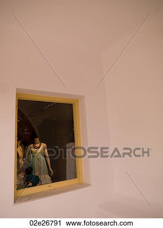 Stock Image - Mannequin in store window in Mykonos Greece. Fotosearch