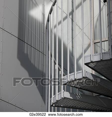 Metal spiral staircase and shadow View Large Photo Image Stock Image - Metal spiral staircase and shadow. Fotosearch