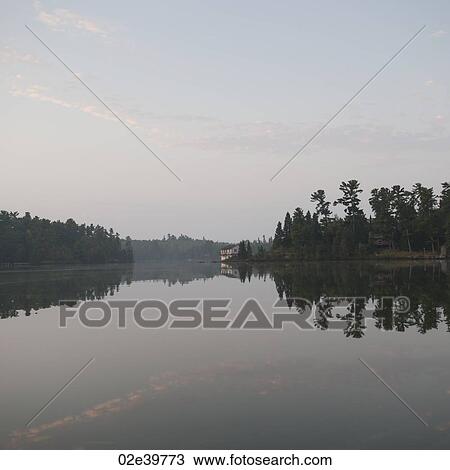 Misty sky over Lake of the Woods, Ontario View Large Photo Image Stock Image - Misty sky over Lake of the Woods, Ontario. Fotosearch