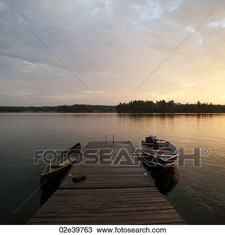 Motorboat at the dock in Lake of the Woods, Ontario View Large Photo Image Stock Image - Motorboat at the dock in Lake of the Woods, Ontario. Fotosearch