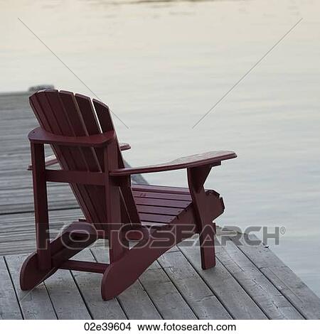 Muskoka chair on dock at Lake of the Woods, Ontario View Large Photo Image Picture - Muskoka chair on dock at Lake of the Woods, Ontario. Fotosearch