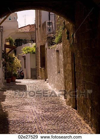 Narrow street in Rhodes Greece View Large Photo Image Stock Photo - Narrow street in Rhodes Greece. Fotosearch