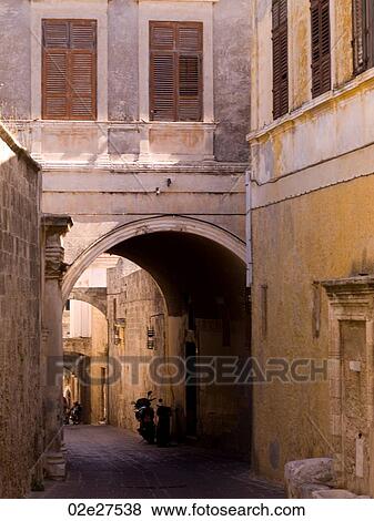 Narrow street in Rhodes Greece View Large Photo Image Stock Photo - Narrow street in Rhodes Greece. Fotosearch