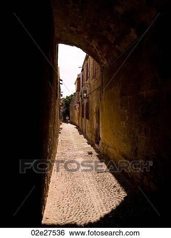 Narrow street in Rhodes Greece View Large Photo Image Stock Photograph - Narrow street in Rhodes Greece. Fotosearch