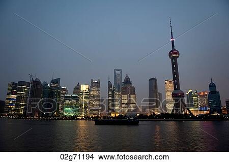 Oriental Pearl Tower and city skyline, Huangpu River, Pudong, Shanghai, China View Large Photo Image Picture - Oriental Pearl Tower and city skyline, Huangpu River, Pudong, Shanghai, China. Fotosearch