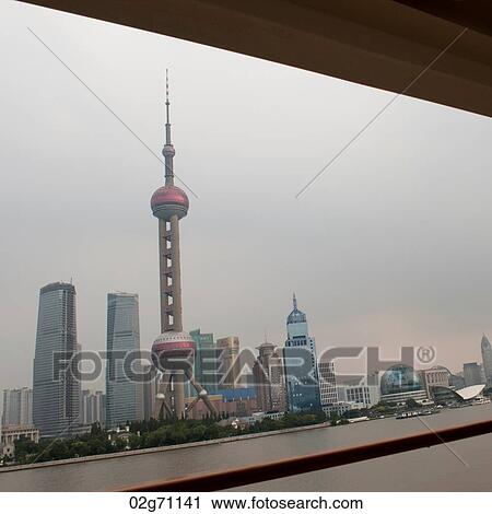 Oriental Pearl Tower and city skyline, Huangpu River, Pudong, Shanghai, China View Large Photo Image Stock Image - Oriental Pearl Tower and city skyline, Huangpu River, Pudong, Shanghai, China. Fotosearch