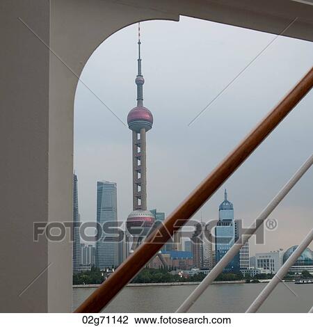 Stock Image - Oriental Pearl Tower and city skyline, Huangpu River, Pudong, Shanghai, China. Fotosearch