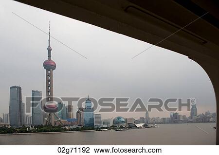 Oriental Pearl Tower and city skyline, Huangpu River, Pudong, Shanghai, China View Large Photo Image Stock Image - Oriental Pearl Tower and city skyline, Huangpu River, Pudong, Shanghai, China. Fotosearch