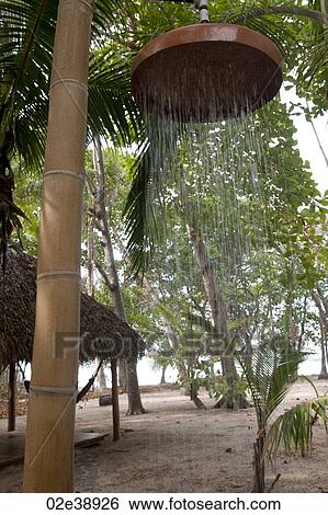 Outdoor beach shower suspended from a bamboo pole in a sandy forest View Large Photo Image Stock Photograph - Outdoor beach shower suspended from a bamboo pole in a sandy forest. Fotosearch