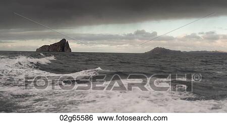 Pacific Ocean with Kicker Rock in the background, San Cristobal Island, Galapagos Islands, Ecuador View Large Photo Image Stock Photograph - Pacific Ocean with Kicker Rock in the background, San Cristobal Island, Galapagos Islands, Ecuador. Fotosearch