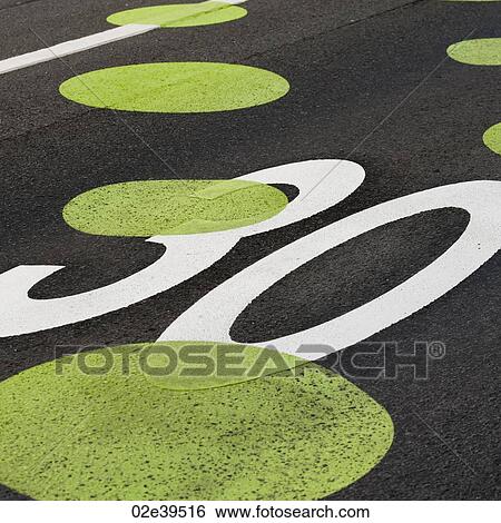 Stock Photograph - Painted dots on roadway speed limit. Fotosearch