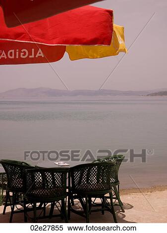 Stock Photography - Patio furniture along seashore in Kusadasi Turkey. Fotosearch
