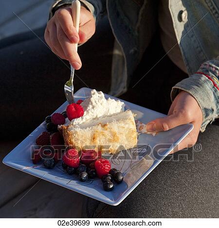 Person holding a plate of food View Large Photo Image Stock Photo - Person holding a plate of food. Fotosearch