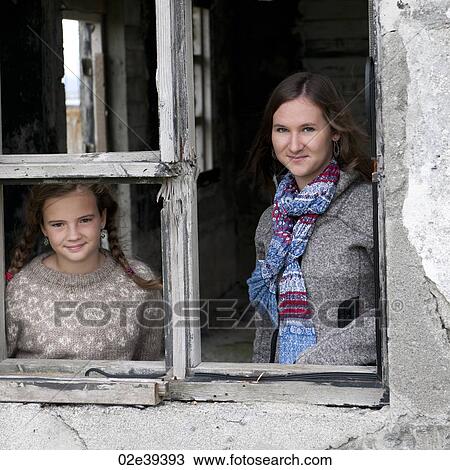 Portrait, girls through weathered window frame View Large Photo Image Stock Image - Portrait, girls through weathered window frame. Fotosearch