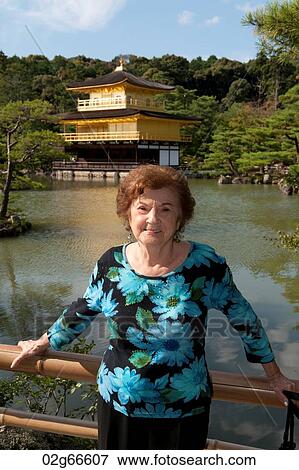 Portrait of a woman in front of Kinkaku-Ji Temple, Kyoto, Japan View Large Photo Image Stock Photo - Portrait of a woman in front of Kinkaku-Ji Temple, Kyoto, Japan. Fotosearch