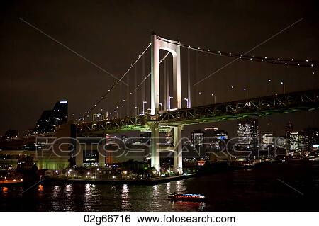 Stock Photograph - Rainbow Bridge across the Tokyo Bay, Minato Ward, Tokyo, Japan. Fotosearch
