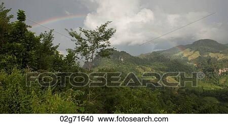 Rainbow over a mountain range, Thailand View Large Photo Image Stock Image - Rainbow over a mountain range, Thailand. Fotosearch