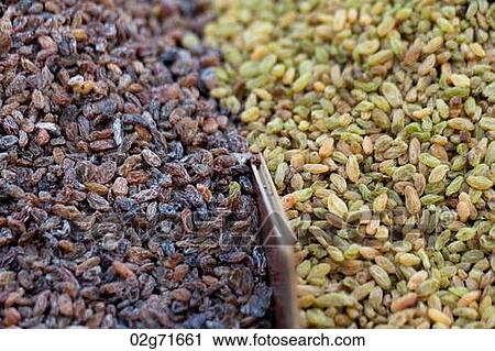 Stock Image - Raisins at a market stall, Binhai, Tianjin, China. Fotosearch