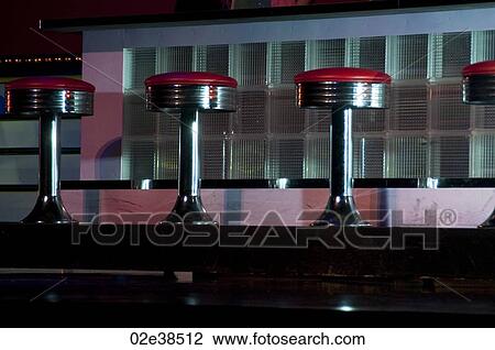 Stock Image - Red bar stools in Branson, Missouri. Fotosearch