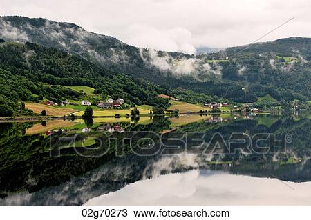 Reflection of mountains in the lake, Granvinsvatnet, Granvin, Hordaland County, Norway View Large Photo Image Stock Image - Reflection of mountains in the lake, Granvinsvatnet, Granvin, Hordaland County, Norway. Fotosearch