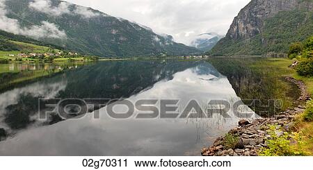 Reflection of mountains on water, Granvinsvatnet, Granvin, Hordaland County, Norway View Large Photo Image Stock Image - Reflection of mountains on water, Granvinsvatnet, Granvin, Hordaland County, Norway. Fotosearch