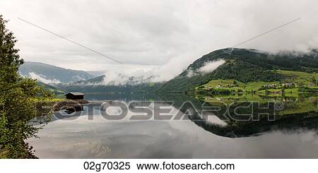 Stock Photography - Reflection of mountains on water, Granvinsvatnet, Granvin, Hordaland County, Norway. Fotosearch