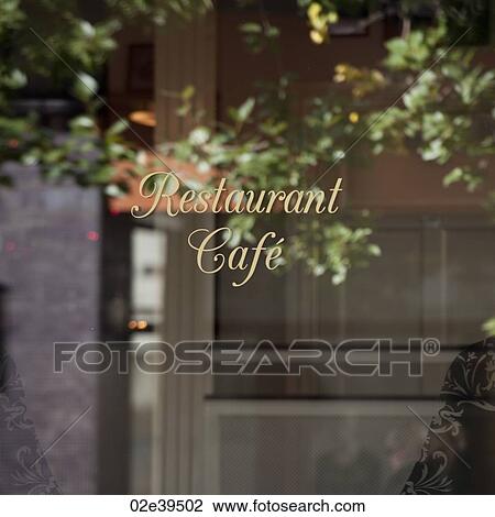 Reflection of tree and office building in signage window of restaurant View Large Photo Image Stock Image - Reflection of tree and office building in signage window of restaurant. Fotosearch