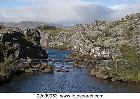 Stock Image - River eroded through rugged rock hills. Fotosearch