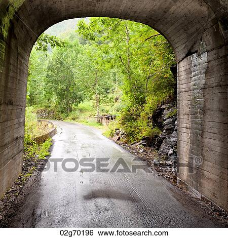 Road passing through a tunnel, Hardangervidda, Hardanger, Norway View Large Photo Image Stock Photograph - Road passing through a tunnel, Hardangervidda, Hardanger, Norway. Fotosearch