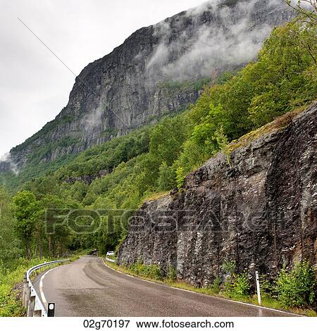Stock Photo - Road passing through mountains, Hardangervidda, Hardanger, Norway. Fotosearch