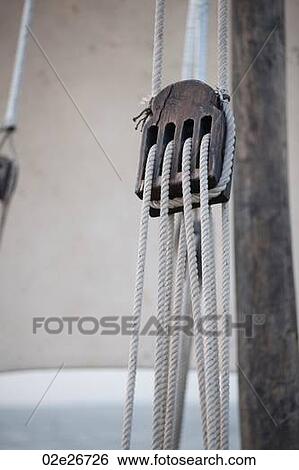Ropes through a pully View Large Photo Image Stock Photograph - Ropes through a pully. Fotosearch