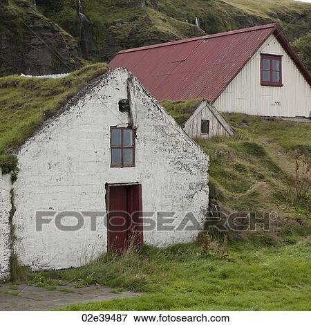 Rural farm buildings buried in hillside and overgrown by grasses View Large Photo Image Stock Photo - Rural farm buildings buried in hillside and overgrown by grasses. Fotosearch