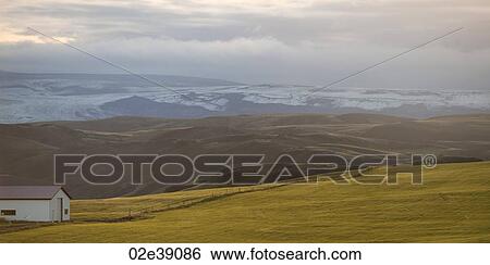 Rural landscape, rolling hills, glacial mountain range View Large Photo Image Stock Photograph - Rural landscape, rolling hills, glacial mountain range. Fotosearch