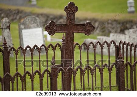 Rusted gate and cross in graveyard View Large Photo Image Stock Image - Rusted gate and cross in graveyard. Fotosearch