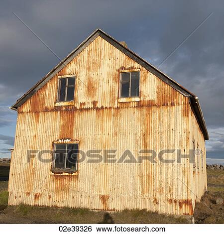 Stock Photograph - Rusted metal structure in countryside. Fotosearch