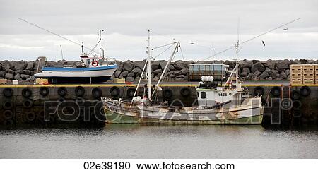 Rusty fishing boat moored at wharf in ocean View Large Photo Image Stock Image - Rusty fishing boat moored at wharf in ocean. Fotosearch