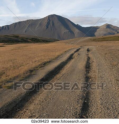Ruts in dirt road leading to mountain View Large Photo Image Stock Image - Ruts in dirt road leading to mountain. Fotosearch