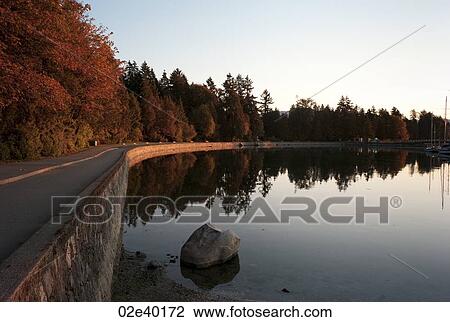 Stock Image - Sea wall at dusk in Vancouver, British Columbia, Canada. Fotosearch