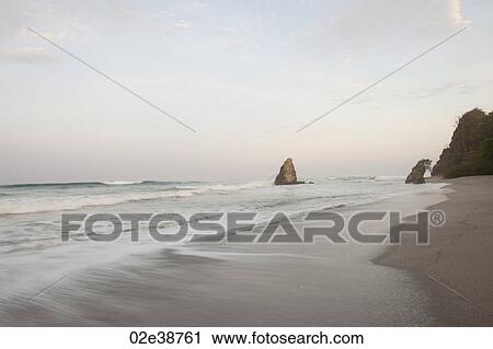 Stock Image - Seascape along Mal Pais coastline in San Jose Costa Rica. Fotosearch