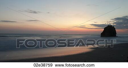 Stock Photo - Seascape along Mal Pais coastline in San Jose Costa Rica. Fotosearch