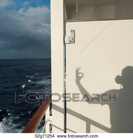 Shadow of a person gesturing on a cruise ship Silver Shadow, East China Sea View Large Photo Image Picture - Shadow of a person gesturing on a cruise ship Silver Shadow, East China Sea. Fotosearch