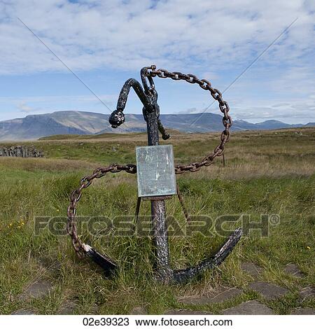 Ship's anchor and welded chain as a signpost in field before mountains View Large Photo Image Stock Image - Ship's anchor and welded chain as a signpost in field before mountains. Fotosearch